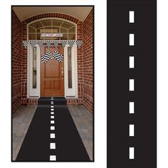 a black and white checkered flag is on the front door to a brick house