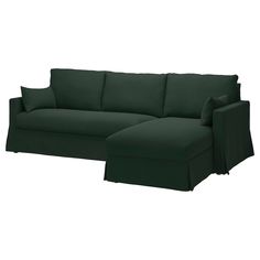 a dark green couch with pillows on the top and bottom half, sitting in front of a white background