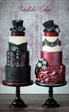 two tiered cakes are decorated with black and red ribbons, laces and bows