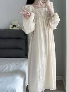 This elegant Coquette Lace Nightgown is crafted from a luxurious blend of fabrics for a comfortable and stylish fit. The all-over lace pattern is subtly sheer for a delicate and feminine look. Its adjustable straps, buttons, and drawstring waist make it the perfect nightgown for a perfect night’s sleep. Lace Long Sleeve Nightgown For Wedding Night, Feminine Lace Sleeved Sleepwear For Wedding Night, Lace Sleepwear With Lace Sleeves, Lace Nightgown With Lace Trim For Sleep, Lace Long Sleeve Nightgown, Beige Sleepwear For Wedding Night In Spring, Beige Spring Wedding Night Sleepwear, Spring Wedding Night Beige Sleepwear, Beige Nightgown For Wedding Night