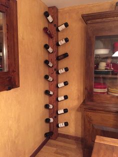 a wine rack in the corner of a room