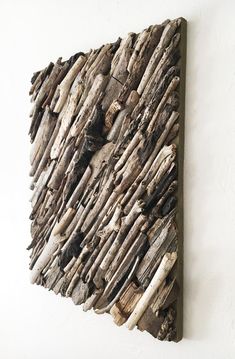 a piece of driftwood is mounted on the wall