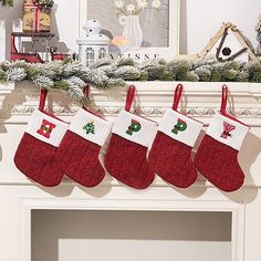 christmas stockings hanging from the mantel over a fireplace