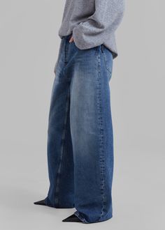 Color: Mid Blue Midweight cotton denim Relaxed fit Wide leg Slant hip pockets Back patch pockets Distressed hem Front button closure Unlined 100% Cotton Gentle Machine Wash Cold By Haikure. Made in Italy Blue Flare Jeans With Belt Loops In Recycled Denim, Blue Wide-leg Cropped Jeans With Belt Loops, Indigo Cotton Flare Jeans With Pockets, High Rise Washed Blue Jeans With Patch Pockets, Indigo Flare Jeans With Pockets, Baggy Denim Jeans With Patch Pockets, Indigo Straight Leg Jeans With Pockets, High Rise Rigid Denim Pants In Denim Blue, Indigo Denim Jeans With Pockets