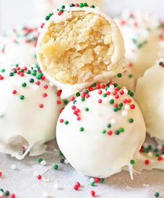 some white cake balls with sprinkles on them