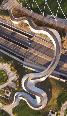 an aerial view of a curved road