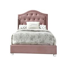 a bed with a pink headboard and pillows on it's sides, in front of a white background