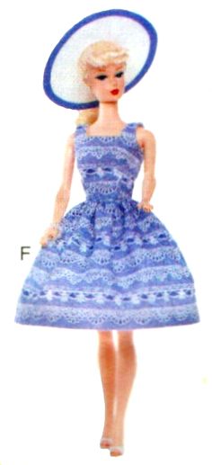 a barbie doll wearing a blue dress and hat