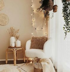 a living room filled with furniture and plants on top of a white rug next to a window