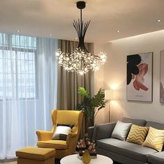 a living room filled with furniture and a chandelier