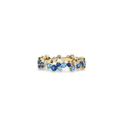 a gold ring with blue stones on it