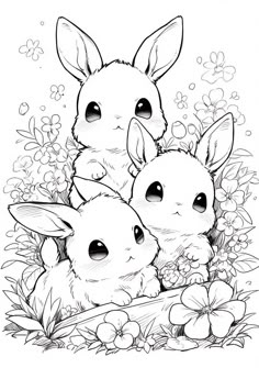 some cute little bunnies sitting in the grass