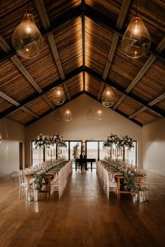 a large room with tables and chairs set up for an event