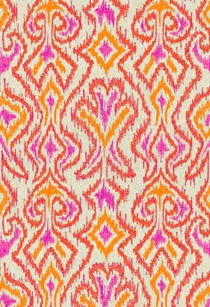 an orange and pink pattern on fabric