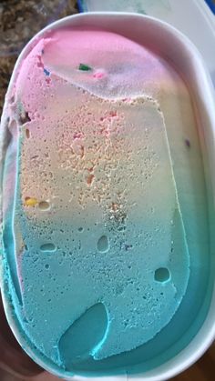 a blue and pink ice cream in a white bowl