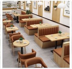 an image of a restaurant setting with wooden tables and brown chairs in the center, along with pictures on the wall