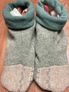 "These slippers are the coziest. They are made from  recycled wool sweaters (washed/felted, taken apart and redesigned),  are fleece lined and even have recycled leather on the sole for a non-slip bottom. The cuff ensures that they keep ankles warm, and don't slip off as some slippers do!   These are a size Large which will fit a foot sizes 9-10.5;they do stretch, since they're made out of sweaters! The bottom sole measures about 11\" long. you can even wash these; lay flat to dry.  I can also m Winter Felt Slippers With Soft Sole, Recycled Wool Sweater Slippers, Sweater Slippers, Slip-on Felt Slippers For Indoor Use, Comfortable Wool Slip-on Slippers, Wool Slip-on Indoor Slippers, Recycled Wool Sweater, Wool Slippers, Barefoot Shoes