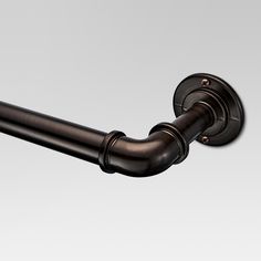 a close up of a metal curtain rod