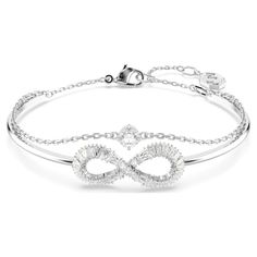 Infused with delicate beauty and symbolism, this Hyperbola bangle can be worn time and time again. The rhodium-plated design features a rigid band with an infinity motif, which is adorned with clear Swarovski Zirconia. A second chain has also been added, with a single round Swarovski Zirconia set at the center. A stunning double-wrapped bangle that will effortlessly carry you from day to night. Finnish Jewelry, The Bangles, White Crystals, Pierced Jewelry, Swarovski Jewelry, Single Earring, Polish Jewelry, Adjustable Bracelet, Crystal Pendant