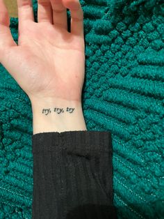 a person's hand with a small tattoo on their wrist that says, my joy