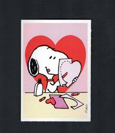 a card with a drawing of a snoopy dog holding a heart shaped object in it's hands