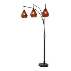 three light floor lamp with an orange glass shade on the top and two red shades on the bottom