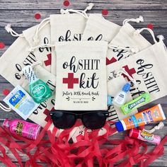 the contents of a personal emergency kit laid out on a table with red streamers