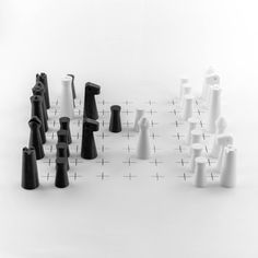 a group of black and white objects sitting on top of a table next to each other