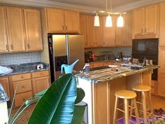 a kitchen with wooden cabinets and an island