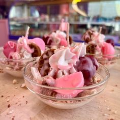 three bowls filled with desserts on top of a table