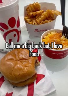 a burger and fries on a table with the caption call me a big back but i love food