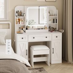 a bedroom with a white vanity, mirror and stools in front of the bed