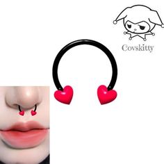 two red hearts are attached to a black headband with the word corsity on it