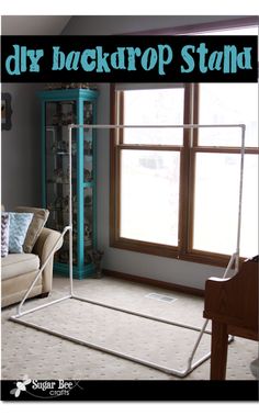 a living room filled with furniture and a tall blue bookcase next to a window