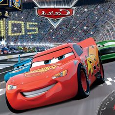 the cars are racing in front of an audience