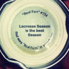 a person holding a small white bottle in their hand with the words lacrosse season is the best season on it