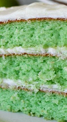 two slices of green cake with white frosting