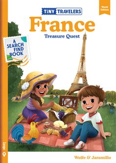 a book with an image of two children sitting on a blanket in front of the eiffel tower