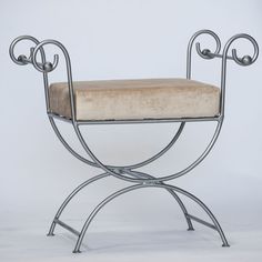 a metal chair with a cushion on it