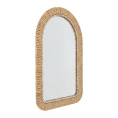 an oval mirror made out of jute and rope on a white background with a reflection in it