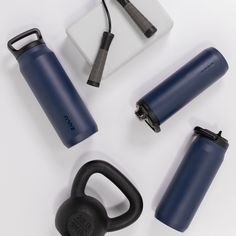 several different types of gym equipment on a white surface