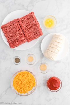 ingredients to make hamburger patties laid out on a marble counter top, including ground beef and cheese