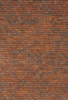 an old brick wall that is red and brown