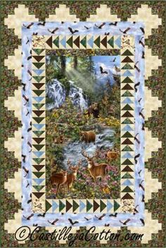 a quilt with deer and waterfall in the background