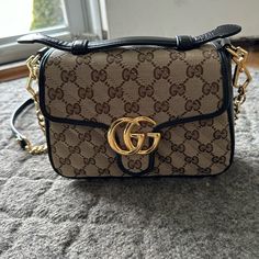 Gucci Shoulder Or Crossbody Bag. Never Worn Or Used. 22in Removable Strap. Bag Is Approximately 9x7x3. Comes With Dust Bag. Designer Brown Shoulder Bag With Cc Turnlock Closure, Chic Gucci Shoulder Bag With Cc Turnlock Closure, Chic Gucci Shoulder Bag With Cc Turnlock, Designer Gucci Bags With Cc Turnlock Closure, Gucci Gg Marmont Mini, Gg Marmont Mini, Gucci Crossbody Bag, Gucci Crossbody, Gucci Gg Marmont