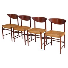 set of four danish modern dining chairs in teak and woven seats