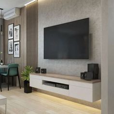 a large flat screen tv mounted to the side of a wall in a living room