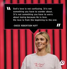 a woman standing in front of a red wall with a speech bubble