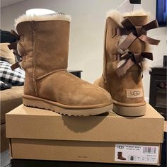 Never Worn Uggs Boots, Tall Ugg Boots With Bows, Ugg Boots Brown, Dark Brown Ugg Boots, Brown Bow Ugg Boots, Ugg Boots With Bows, Ugg Shoes Women, Ugg Classic Ultra Mini, Classic Ugg Boots