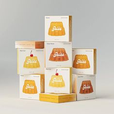 five boxes with different types of cakes on them, each containing an apple and the word gliee